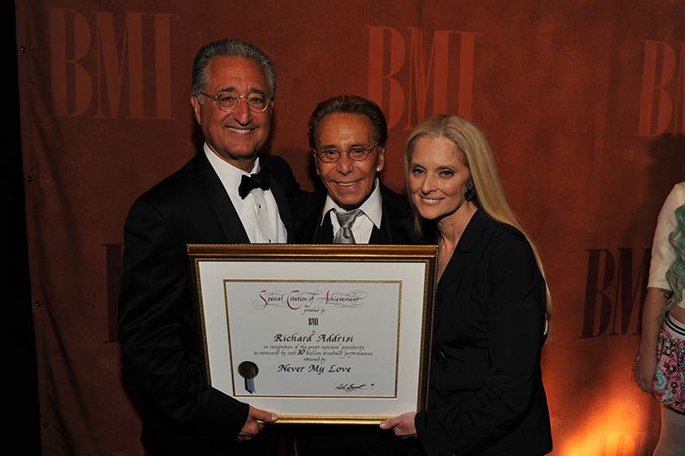 Richard Addrisi receiving the ten million performance certificate with Del Bryant and Barbara Cane